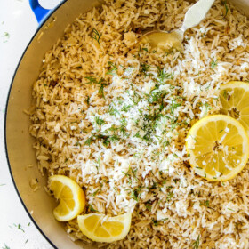 Showing how to make Lemon Rice in rice cooker by adding all ingredients to rice cooker