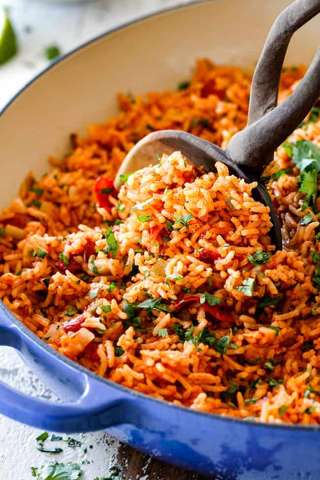 best Mexican Rice in a blue skillet with the optional peas, corn and carrot...