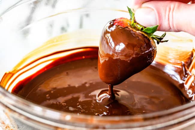 dipping strawberries in melted chocolate howing How to Make Chocolate Covered Strawberries