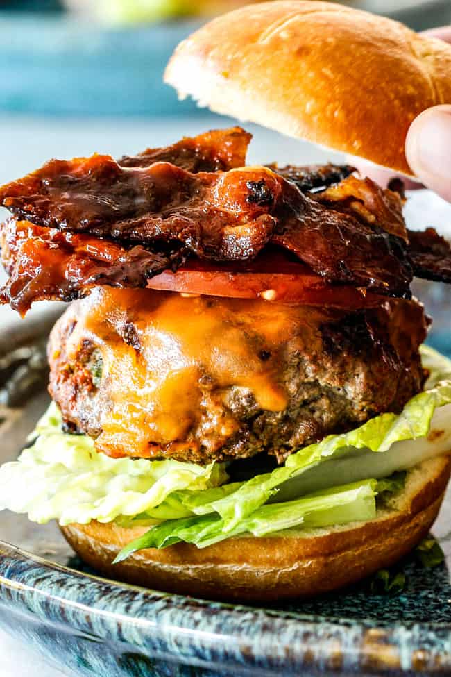 cheeseburger with bacon, lettuce and tomatoes open faced