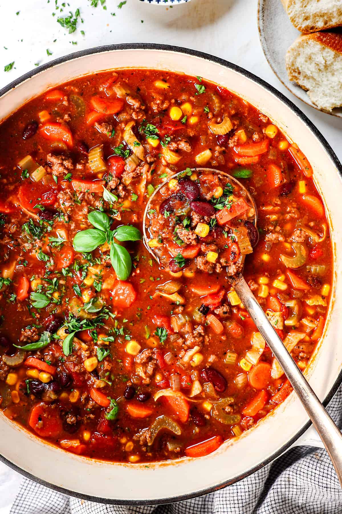 top view of vegetable beef soup recipe made in a Dutch oven showing the consistency