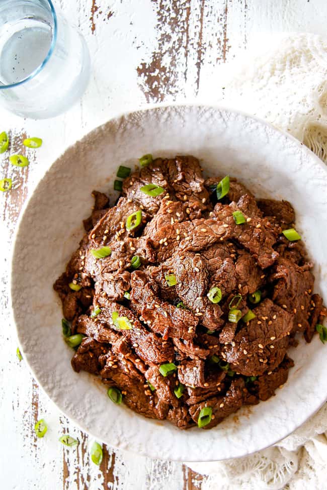 top view of thinly sliced Beef Bulgogi recipe with sesame seeds and green onions