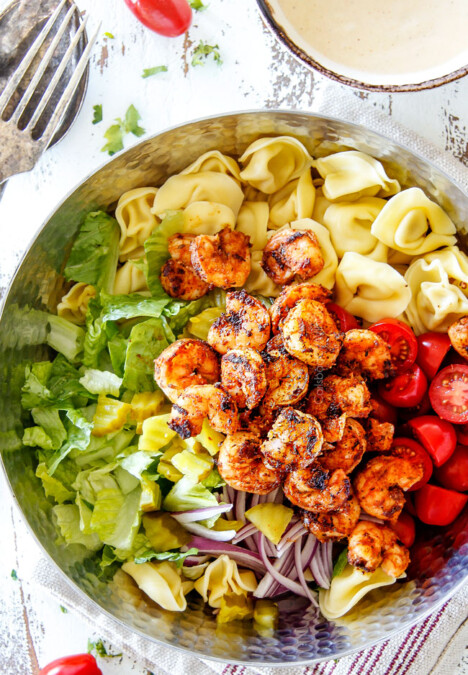 Top view of easy Shrimp Pasta salad with tortellini, lettuce, tomatoes and shrimp