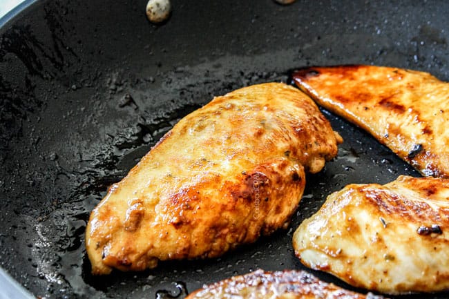 showing how to make cobb salad by cooking chicken in a skillet