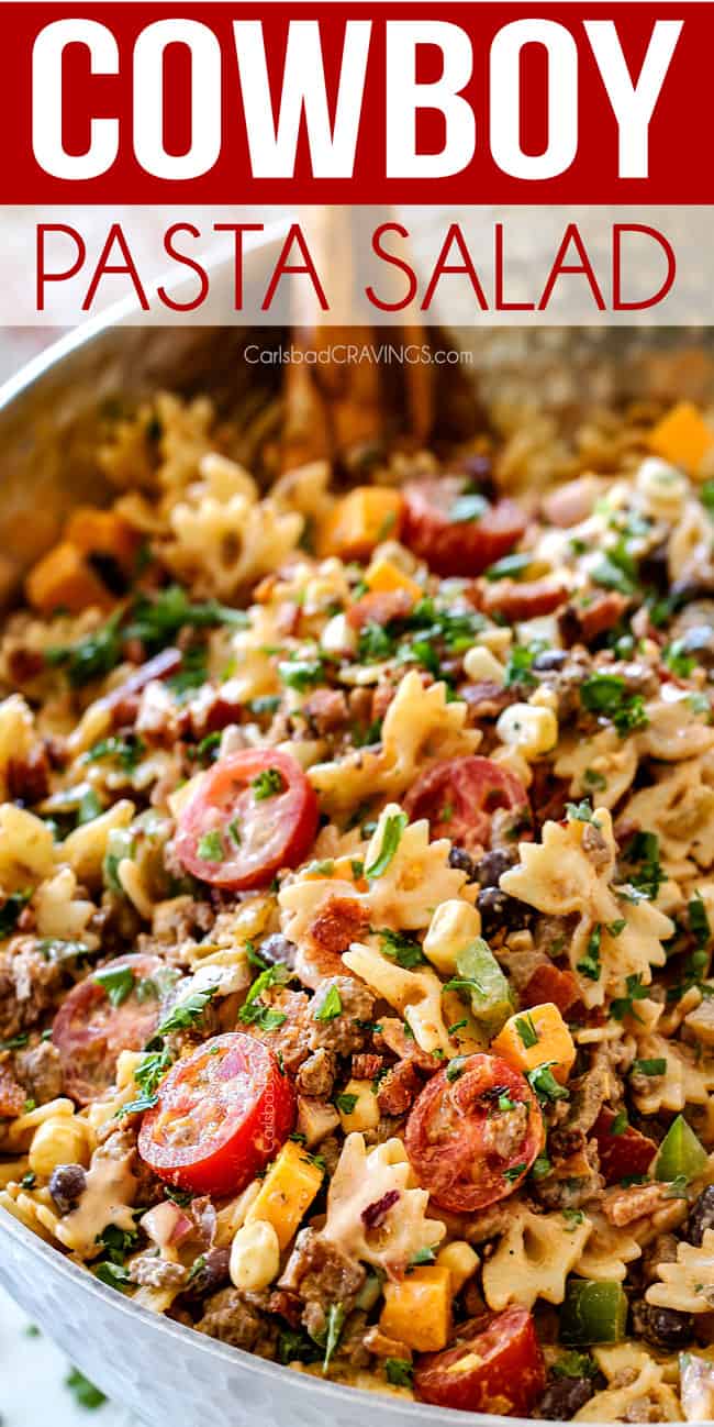 up close of Cowboy Pasta Salad with ground beef, black beans, corn, tomatoes and barbecue sauce in a metal bowl