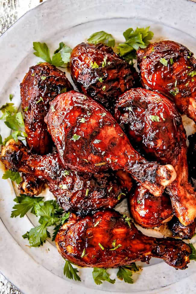 up close view of the best grilled BBQ chicken on a white plate