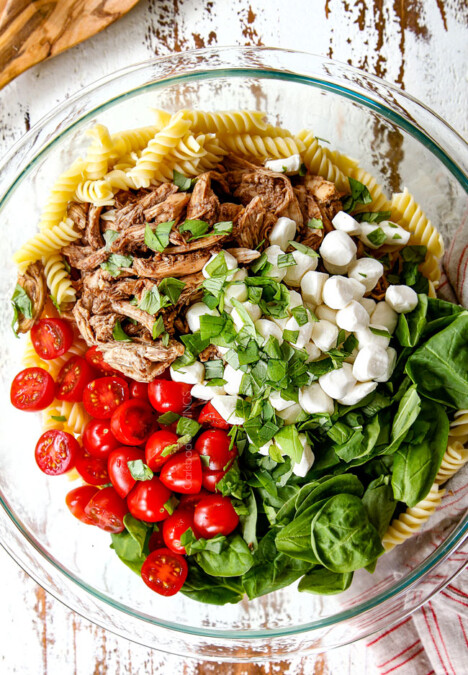 top view showing how to make caprese pasta salad with balsamic chicken, spinach tomatoes mozzarella