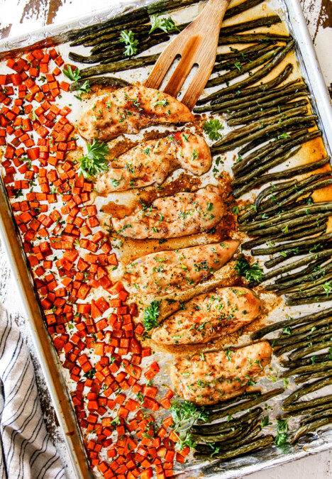 top view of sheet pan chicken and vegetables on a baking sheet