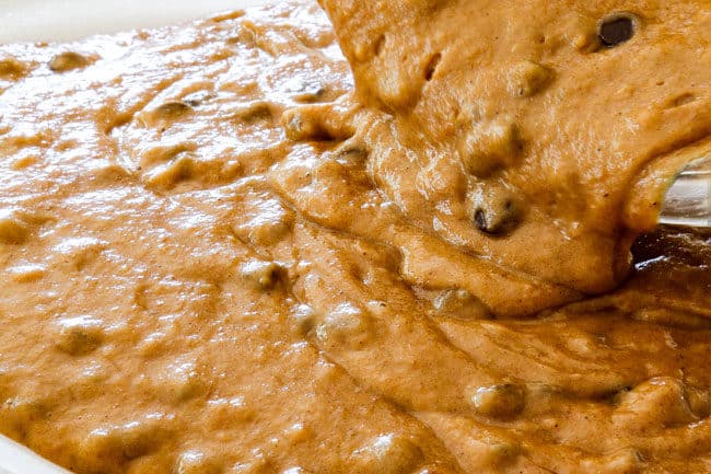 showing how to make pumpkin bars by pouring batter into a baking pan