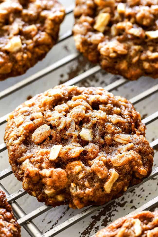showing how to make apple cookies with a apple oatmeal cookie on a cooling rack