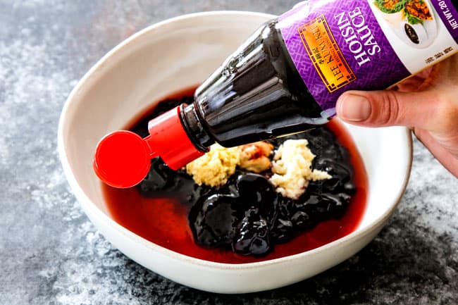 showing how to make hoisin chicken by by adding hoisin, blackberry preserves, vinegar, garlic and ginger to a bowl. 