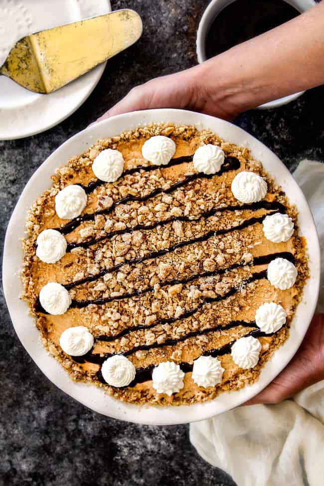 top view holding a pumpkin ice cream pie with graham cracker crust