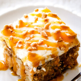 top view of a slice of poke cake drizzled with caramel