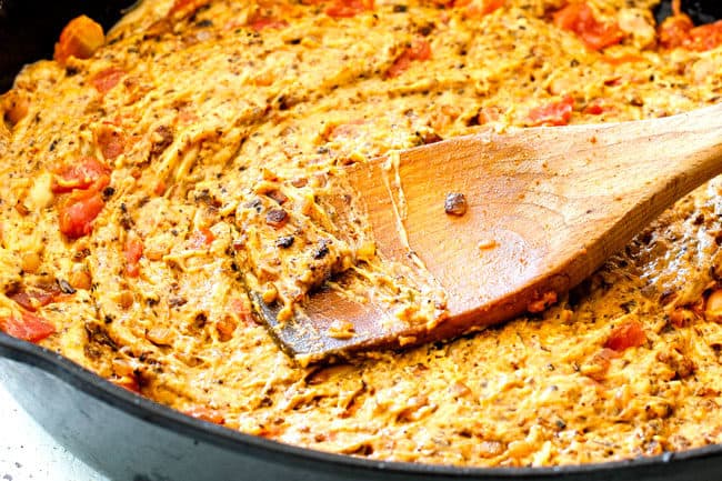 showing how to make Queso Fundido by mixing chorizo and cheese before baking