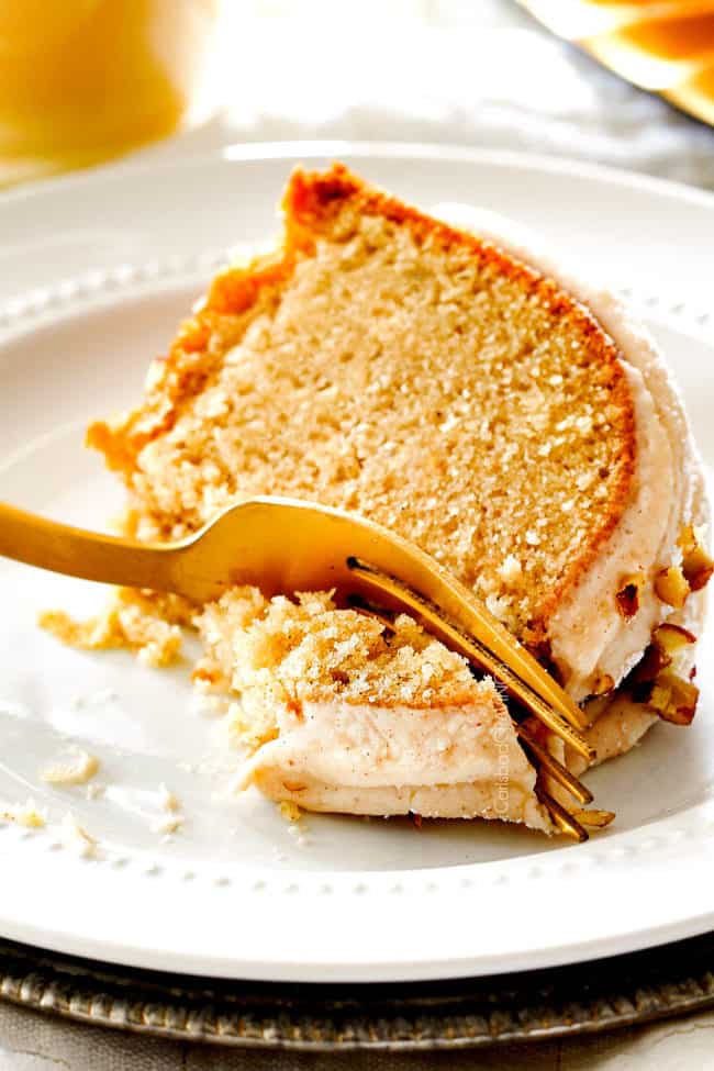 up close of easy eggnog cake on its side with a fork taking a bitee