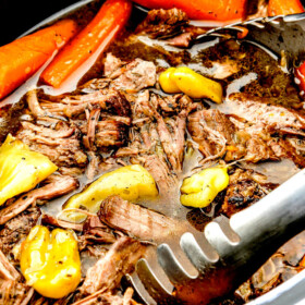 up close of tongs scooping Mississippi Pot Roast from crock pot