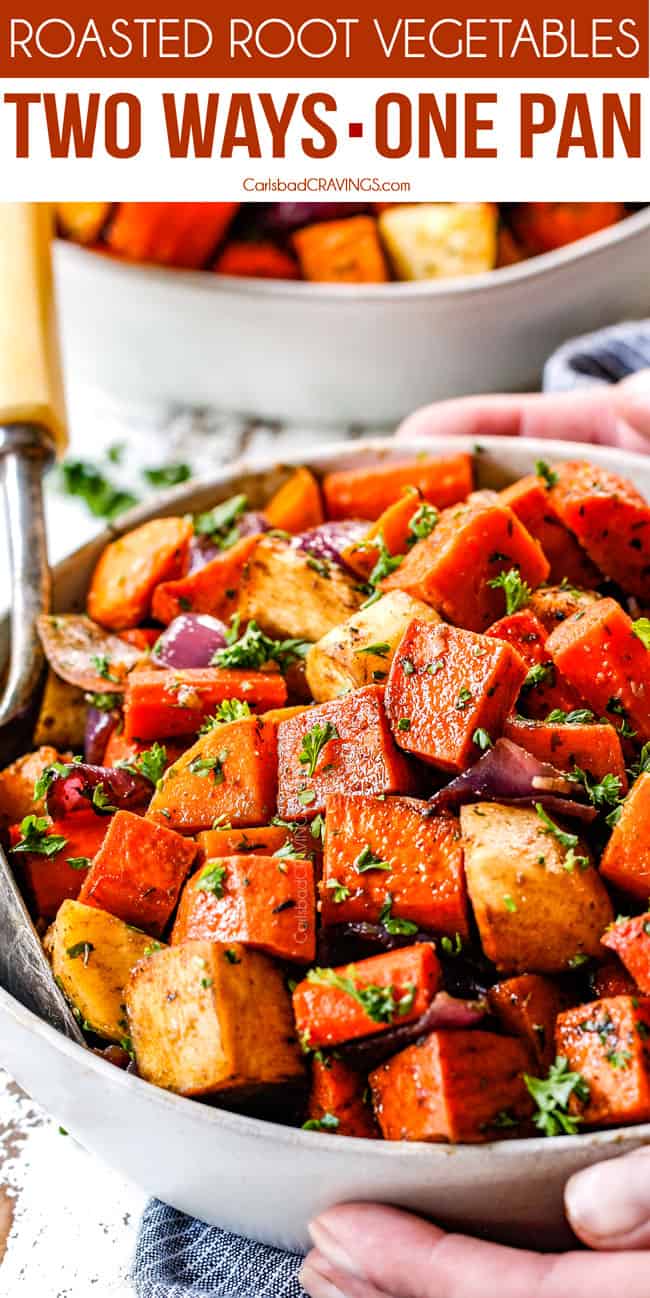 balsamic roasted root vegetables in a white bowl garnished with parsley with a servings spoon