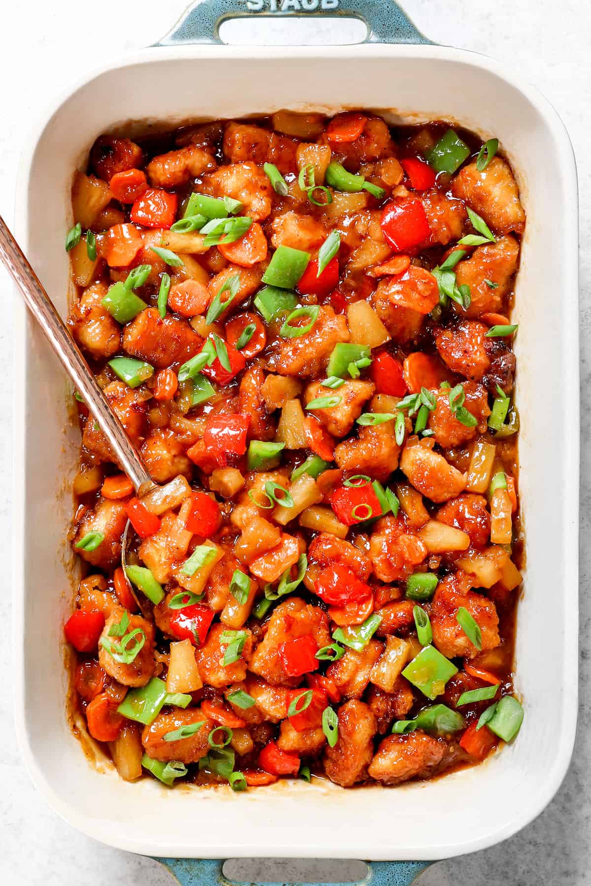 top view of making sweet and sour chicken in a 9x13 baking dish 