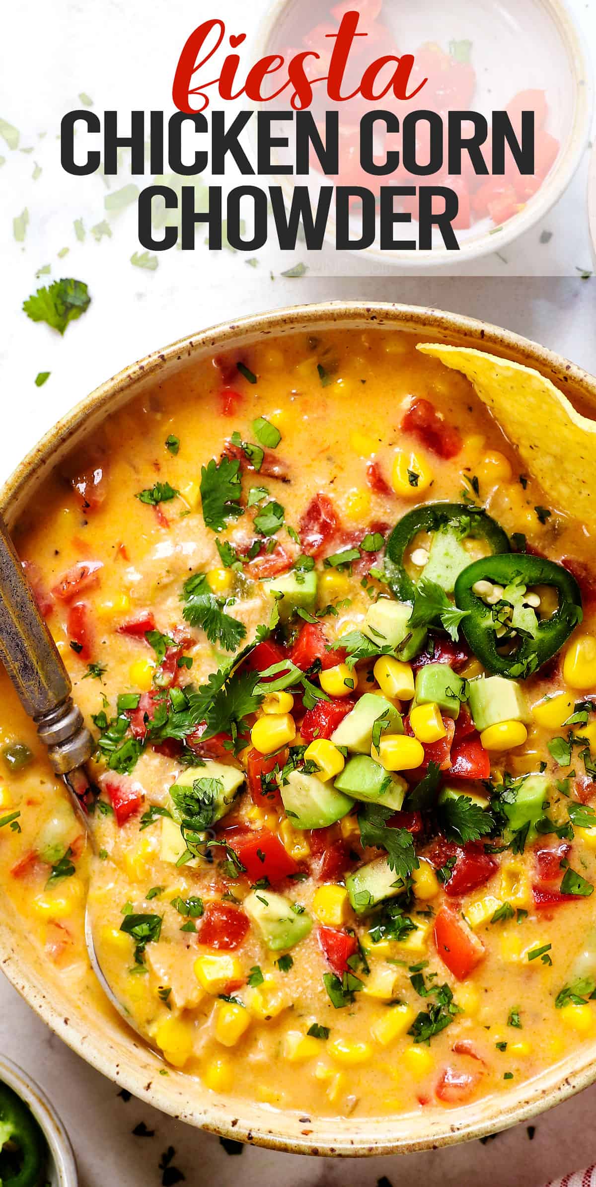 top view of chicken corn chowder recipe being served in a bowl showing how to garnish it with corn, jalapenos and cheese