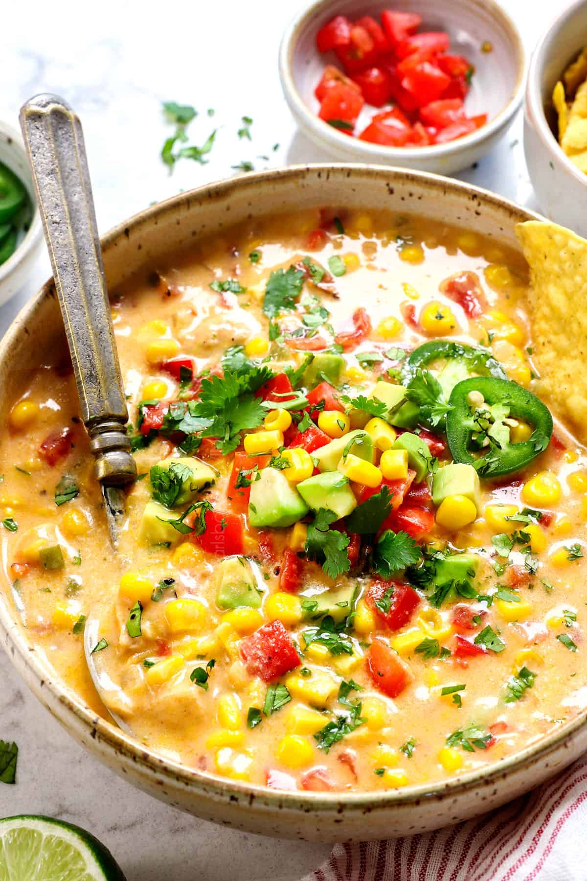 up close of a bowl of chicken corn chowder showing how creamy it is