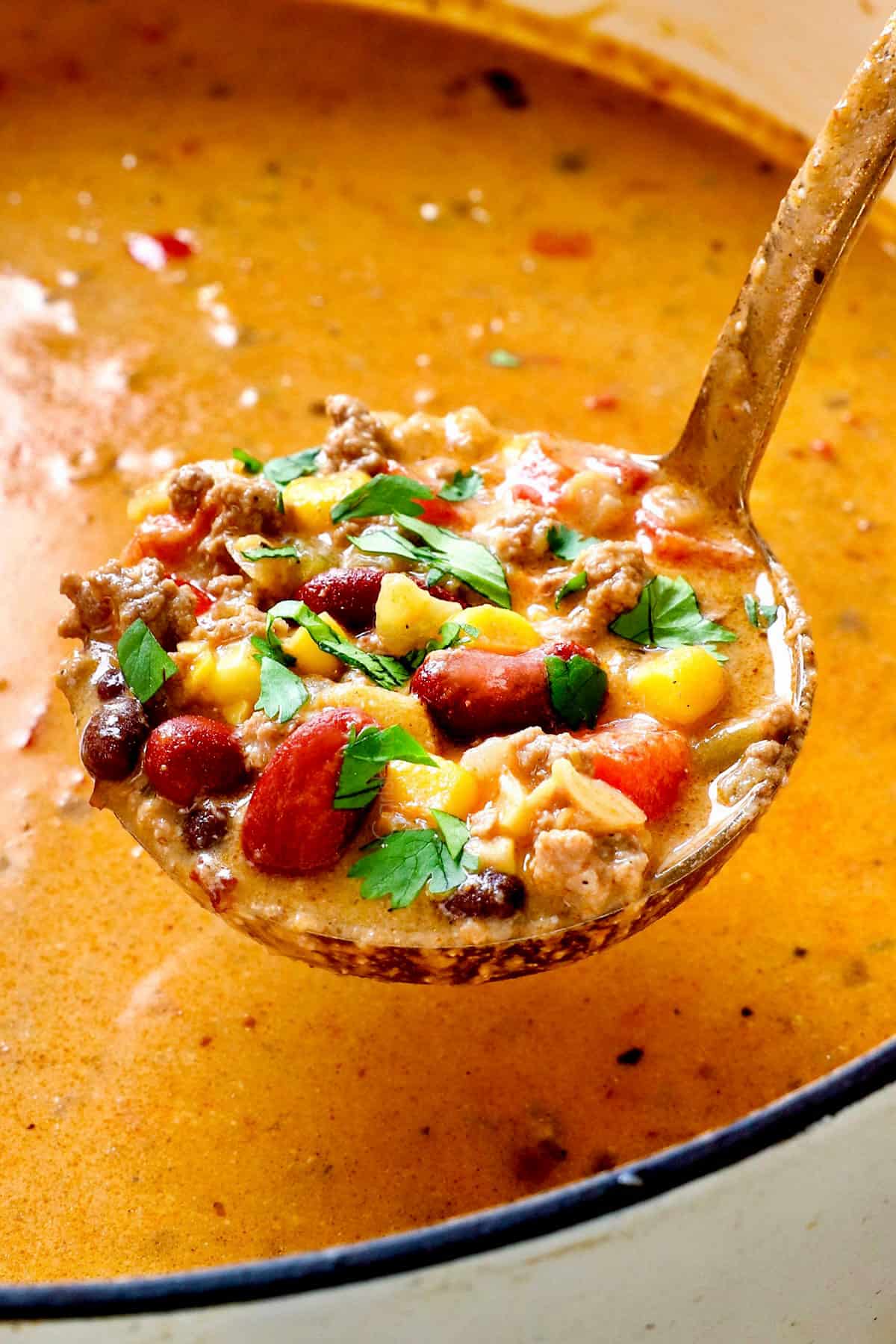 up close of a ladle of creamy taco soup showing how creamy it is