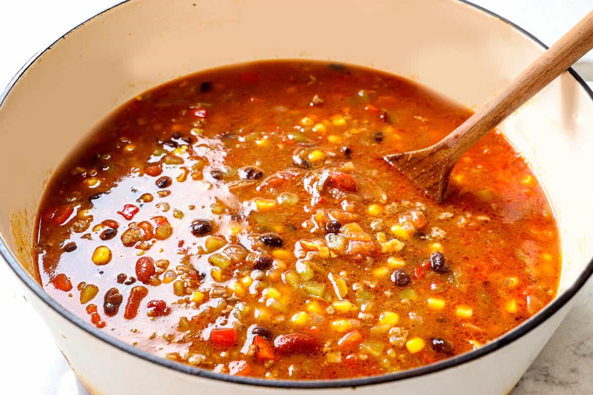 showing how to make taco soup by simmering until slightly thickened