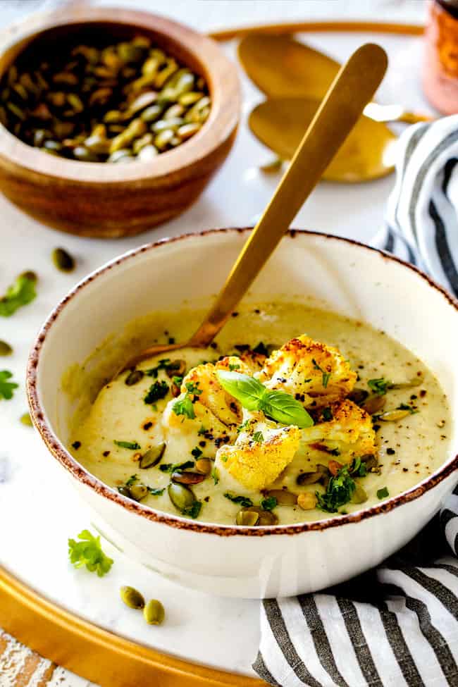 far away shot of a bowl of easy Cauliflower Soup garnished with curry roasted cauliflower