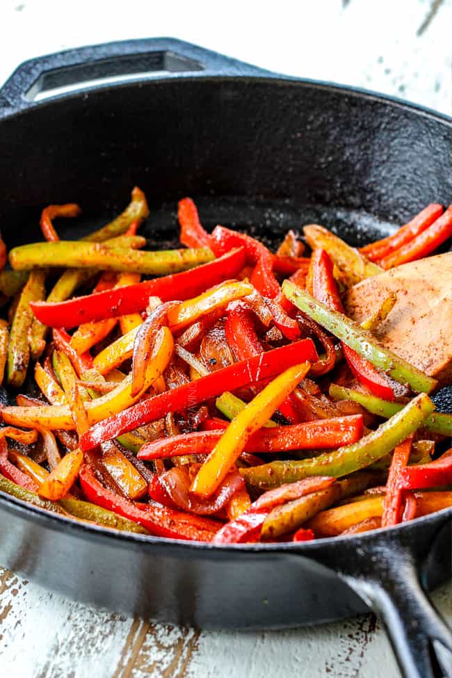 showing how to make pork fajitas by stir frying red, yellow and green bell peppers