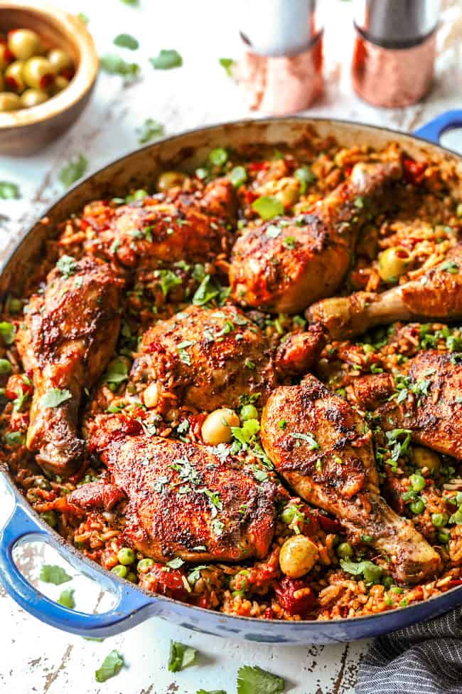 far away side view of Puerto Rican Arroz con Pollo with chicken thighs and chicken drumsticks