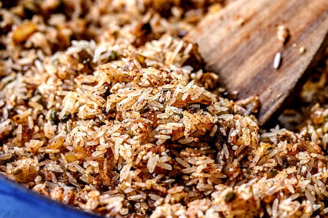 showing how to make Arroz con Pollo by toasting rice