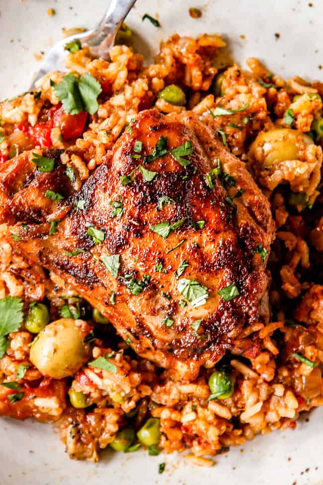 up close top view of a piece of arroz con pollo made with chicken thighs