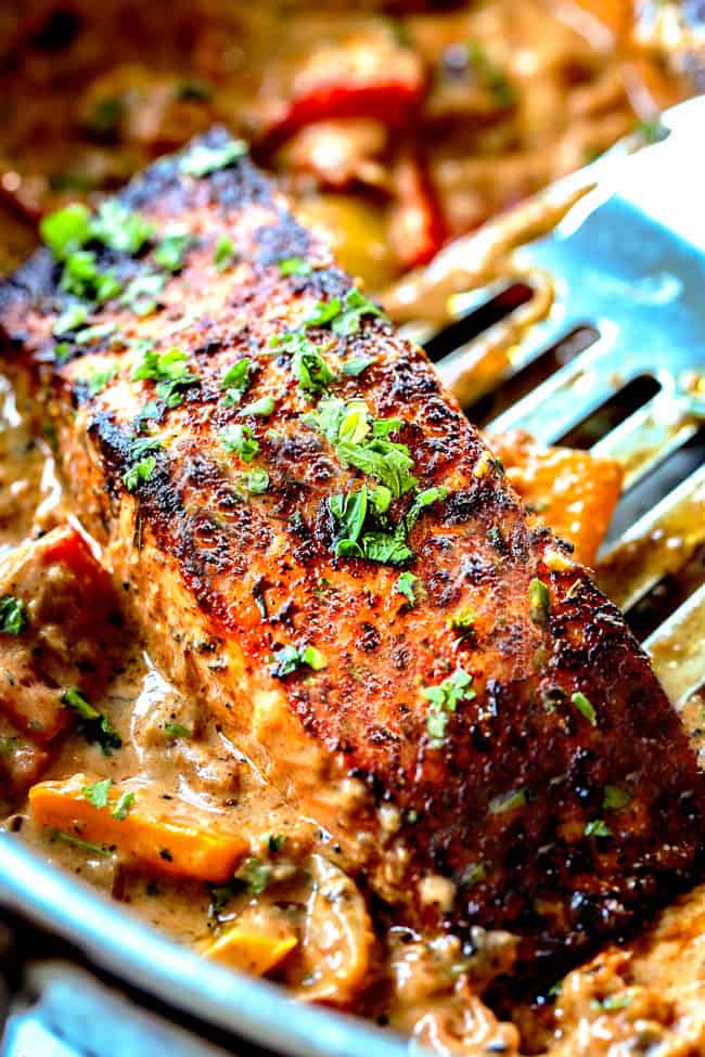 top view of easy blackened salmon in a stainless steal skillet