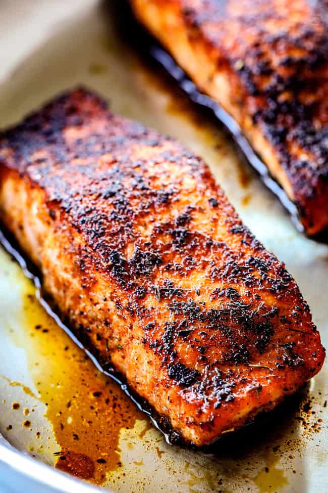 showing how cook blackened salmon in a stainless steel pan