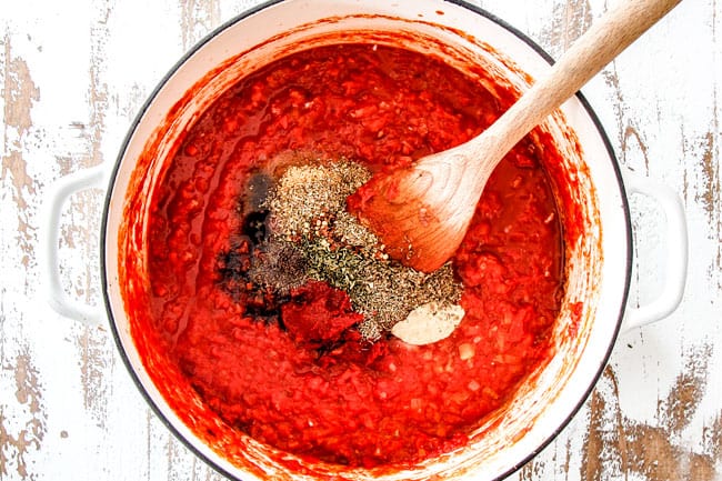 showing how to make marinara sauce by adding basil, parsley, oregano, sugar, salt and pepper in a pot