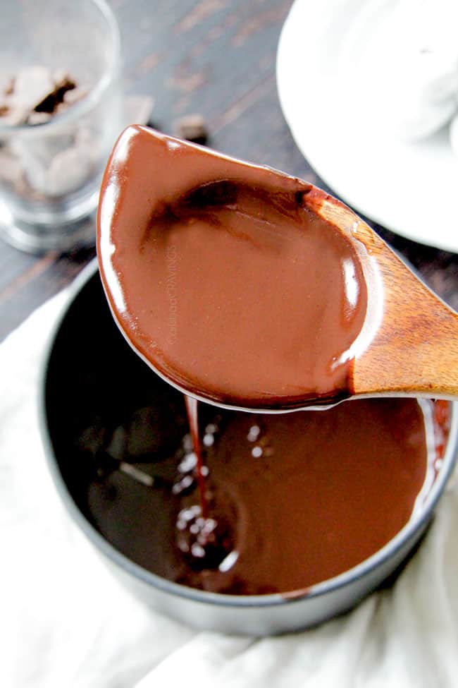 a wooden spoon full of chocolate ganache
