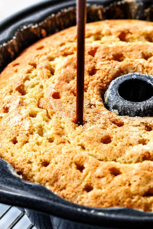 showing how to make Kentucky Butter Cake by poking holes all over the cake