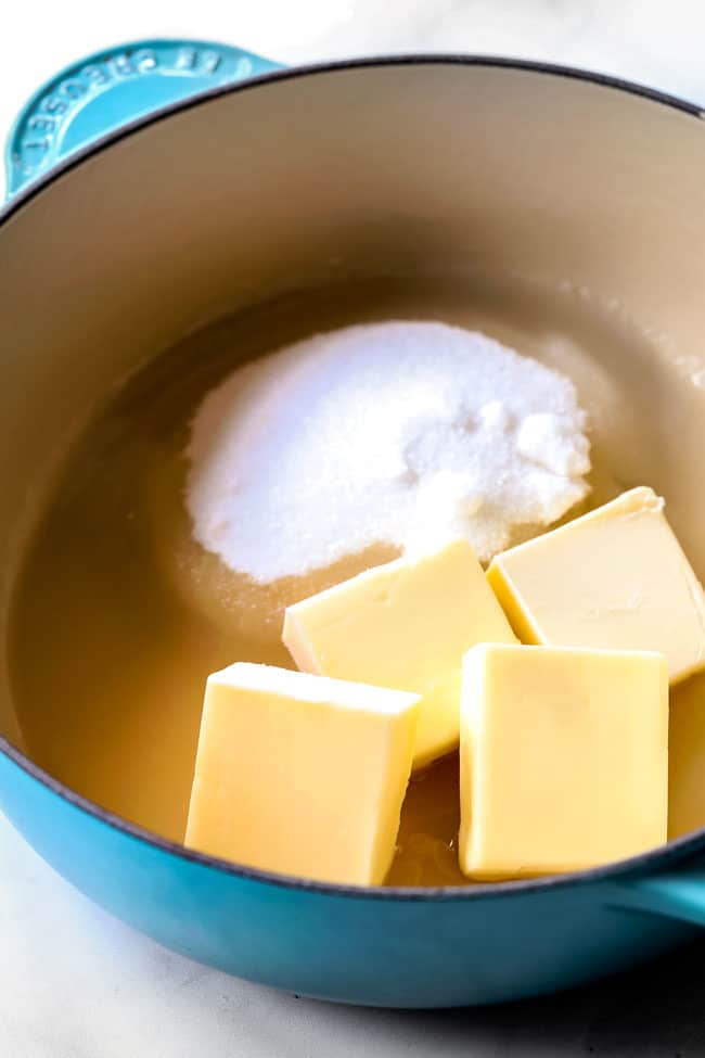 showing how to make Kentucky Butter Cake by making butter sauce by adding butter, water and sugar to saucepan