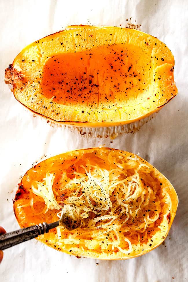 showing how to cook spaghetti squash for spaghetti by shredding cooked spaghetti squash with a fork