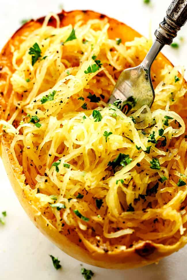 up close of roasted spaghetti squash with a fork in the center