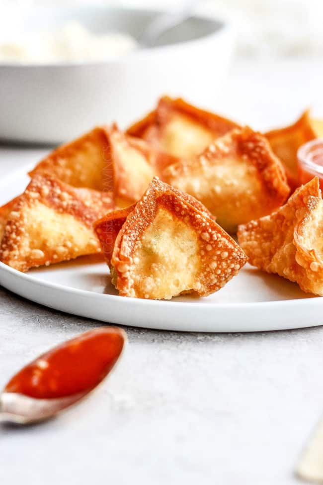 a plate of fried cream cheese wontons
