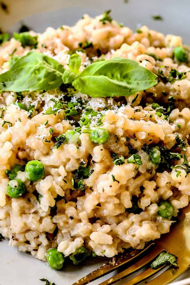 up close of a serving of favorite risotto recipe on a grey plate garnished with parsley