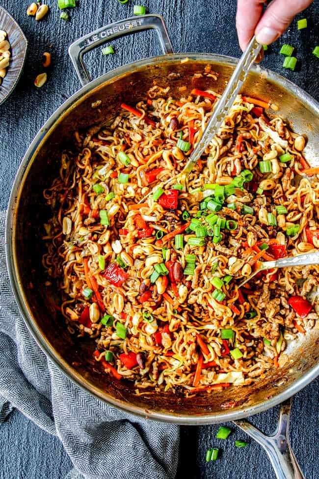 top view of spicy ramen recipe in a large wok with pork