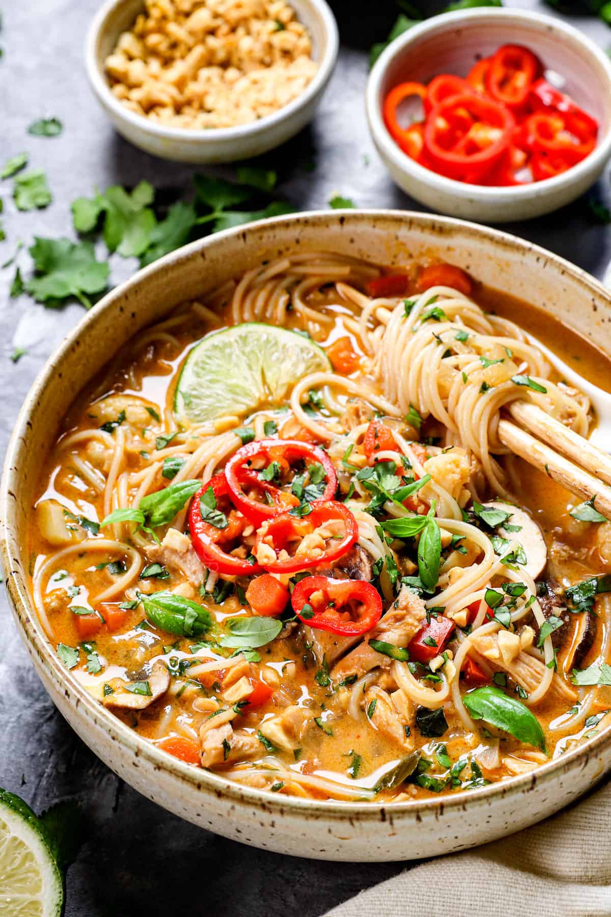 Asian chicken noodle soup with chopsticks