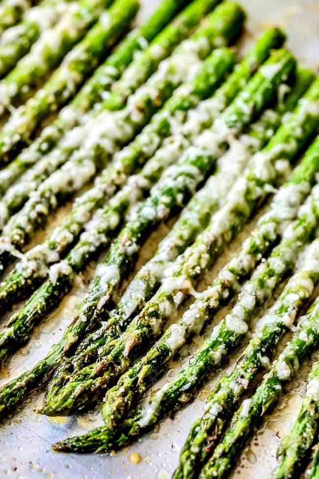 up close of oven baked asparagus with melted Parmesan