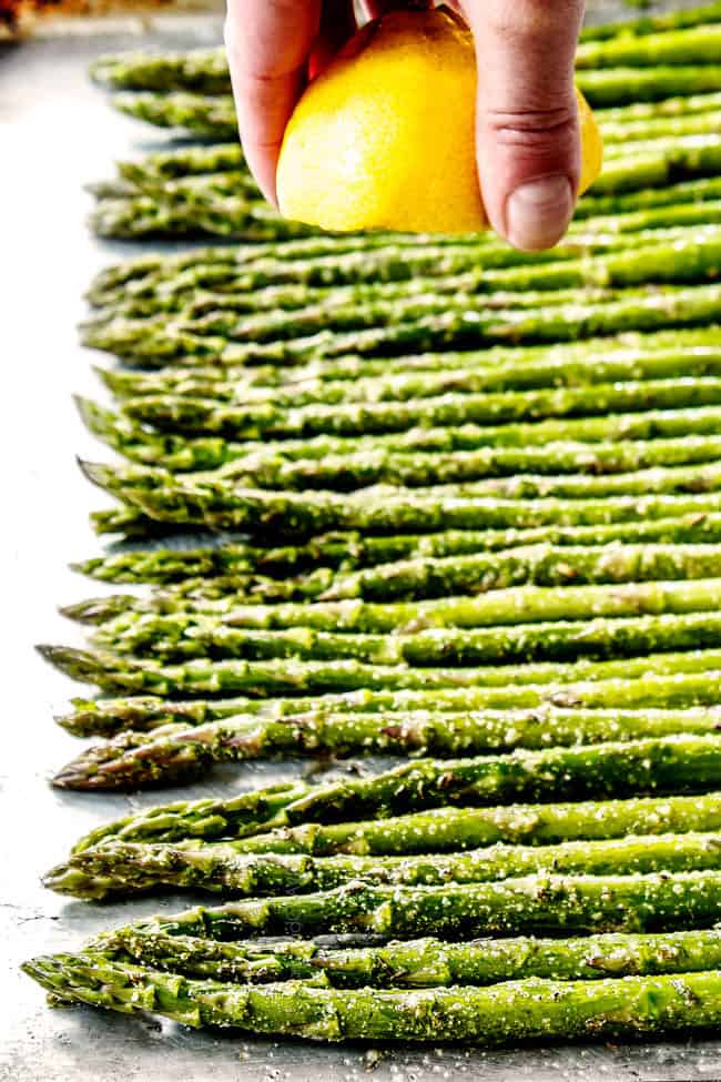 showing how to cook asparagus by squeezing lemon juice over asparagus