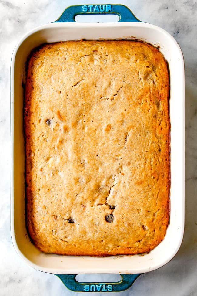 showing how to make banana cake by pulling baked cake out of an oven