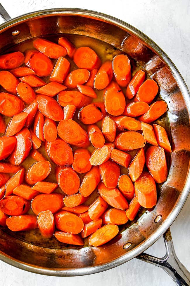 showing how to make glazed carrots by cooking carrots in the stove top in water