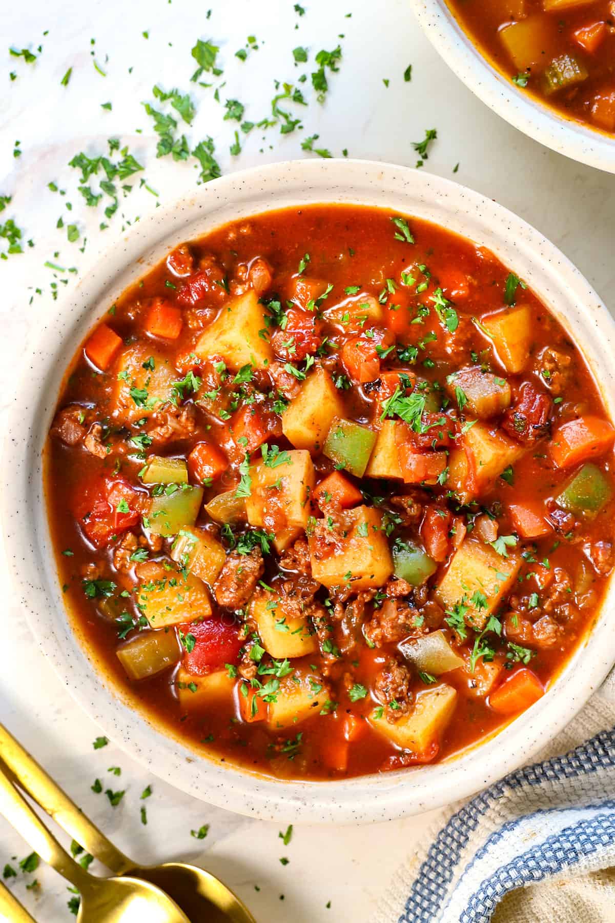 top view of hamburger soup garnished with parsley