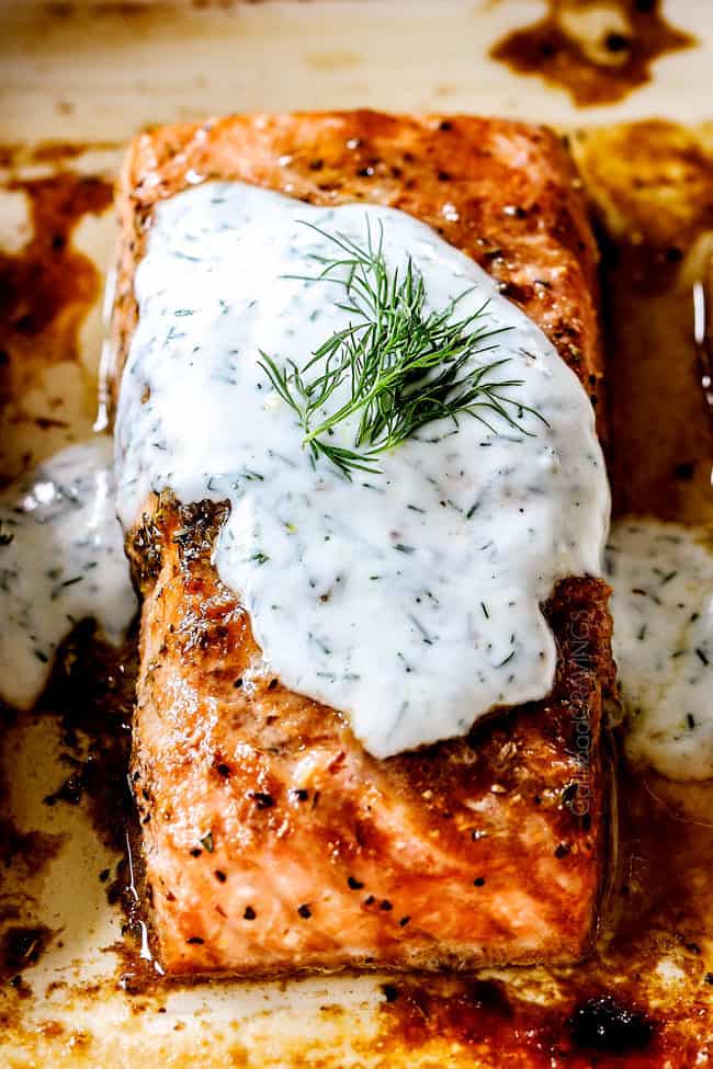 front view of up close of oven baked salmon with dill sauce