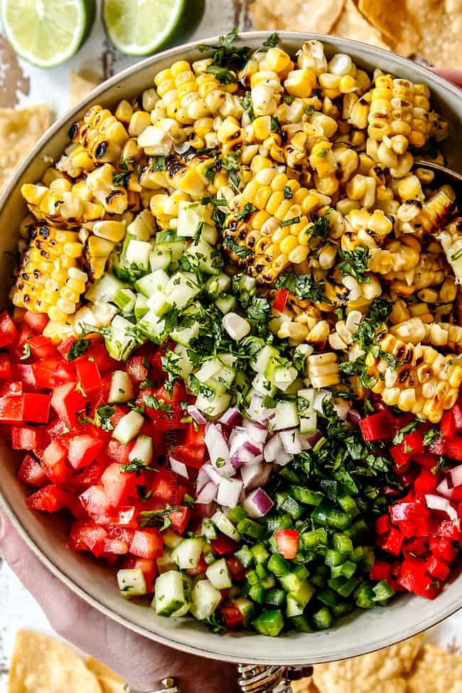 showing how to make corn salsa by making topping of corn salsa